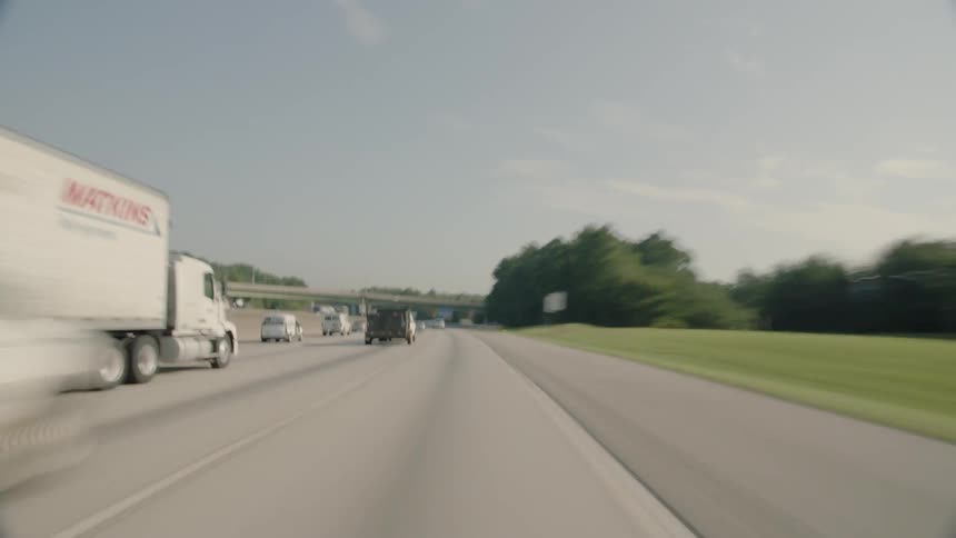 Cars speeding quickly down a highway