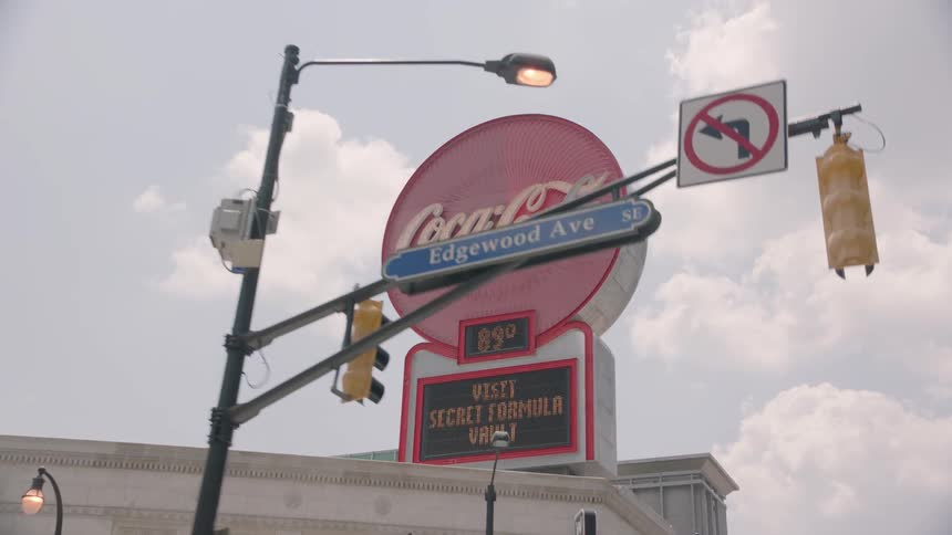 A coca-cola sign in a city