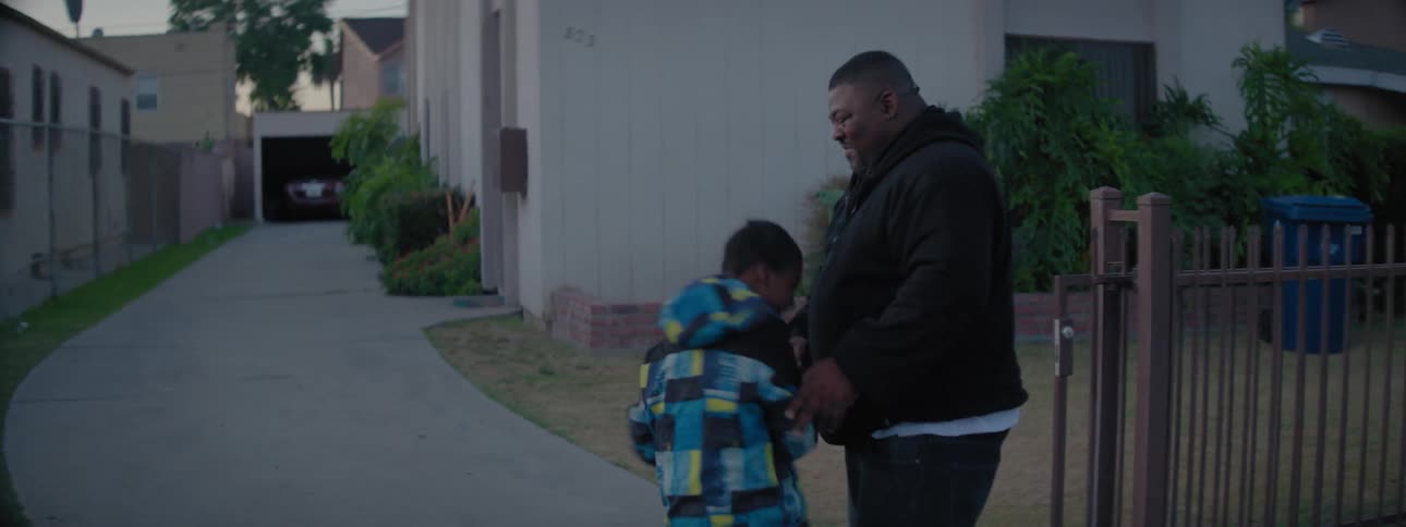 A man is teach his son how to box