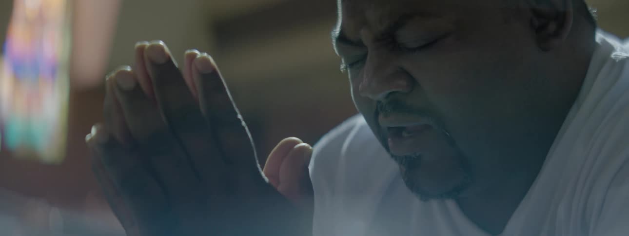 Man prays in a chapel