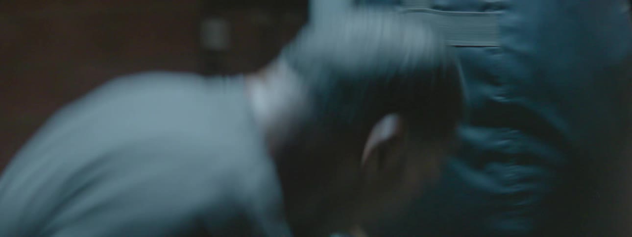 A man punching a punching bag