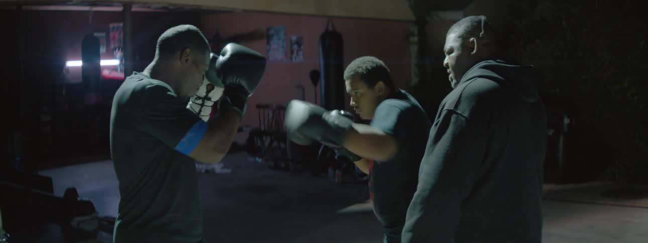 Three men boxing