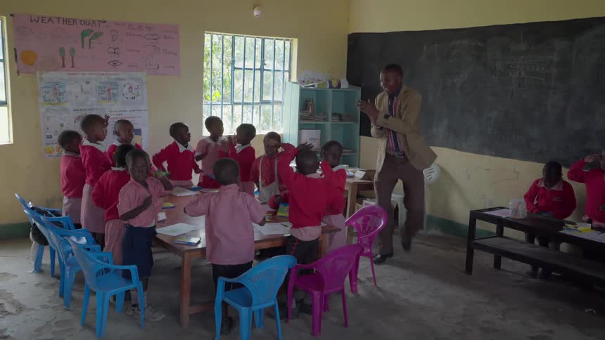 A man teaches his students to dance