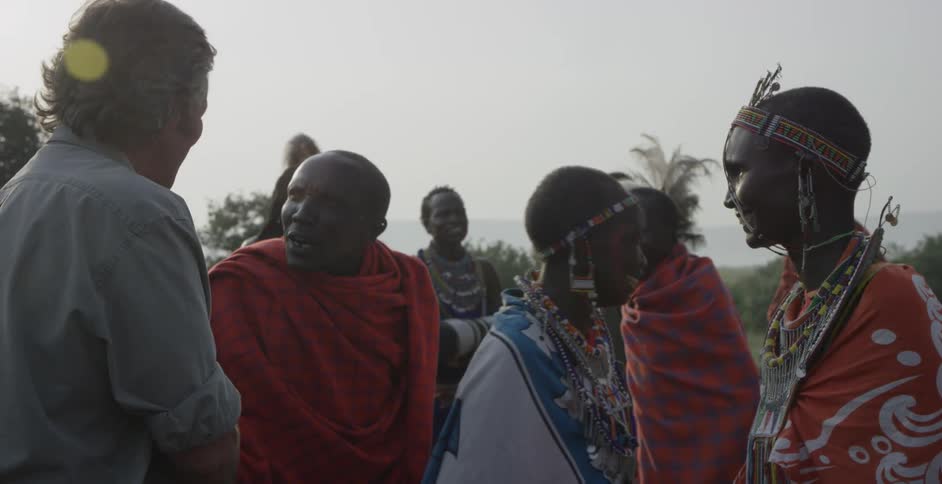 A man is thanking maasai people