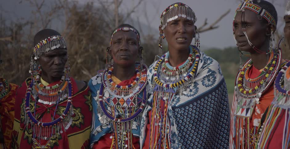 Maasai standing and looking at the camera
