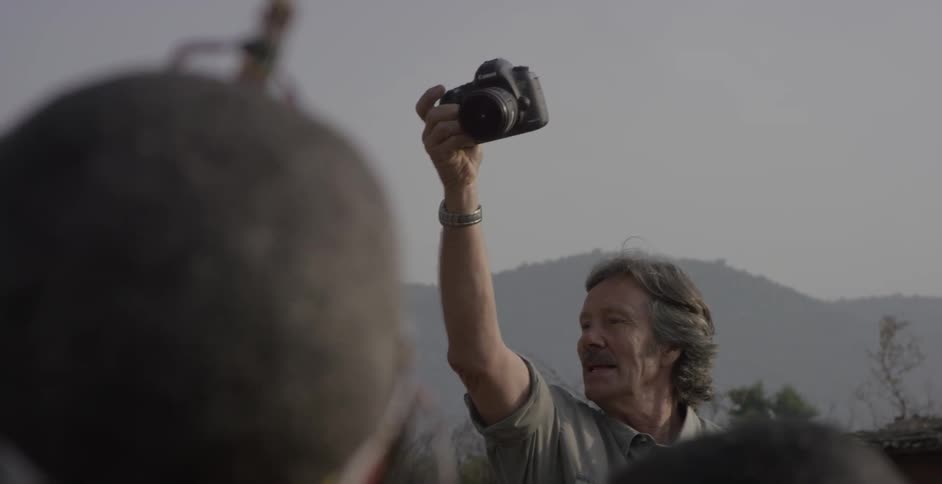Man takes pictures of maasai