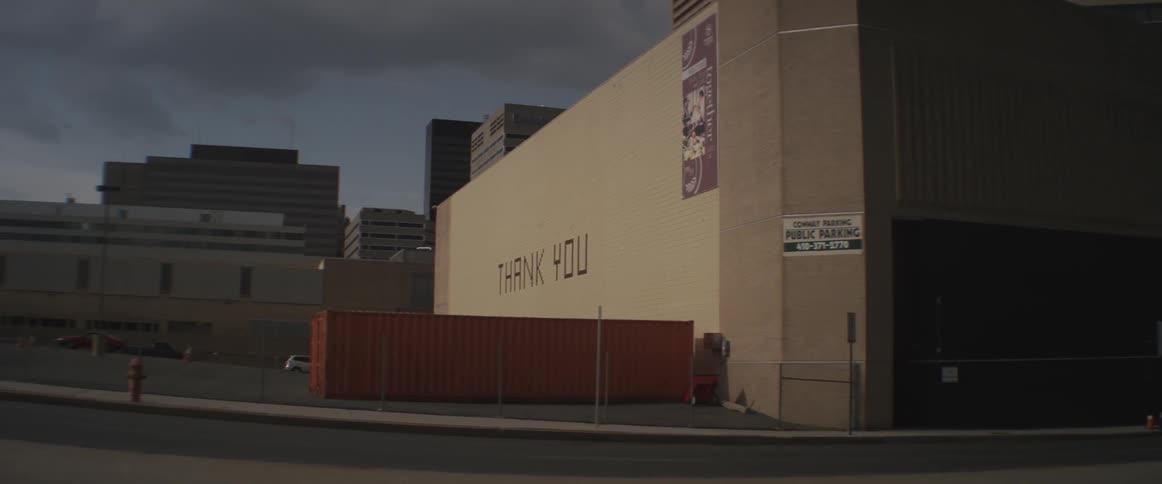 A city warehouse wall displaying a thank you sign