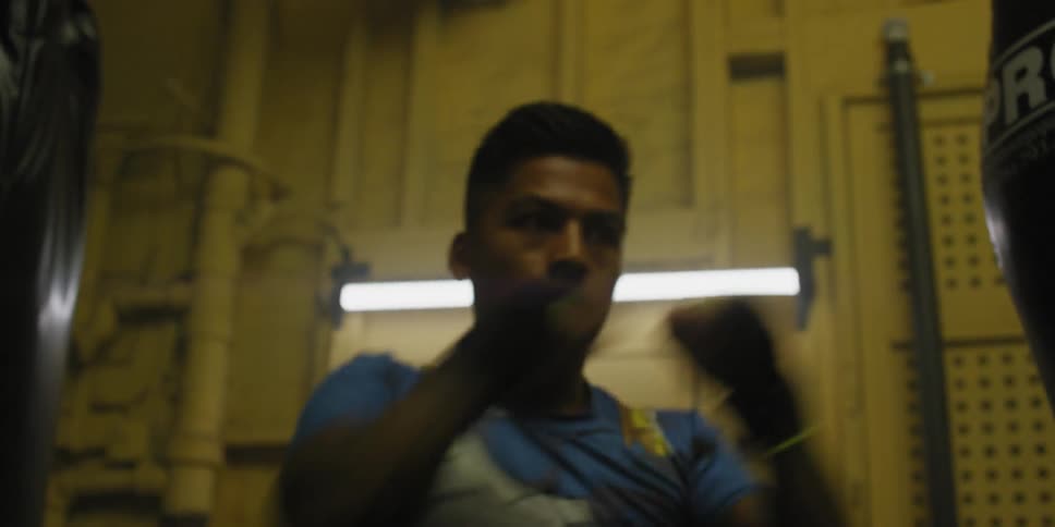 A young man is shadow boxing