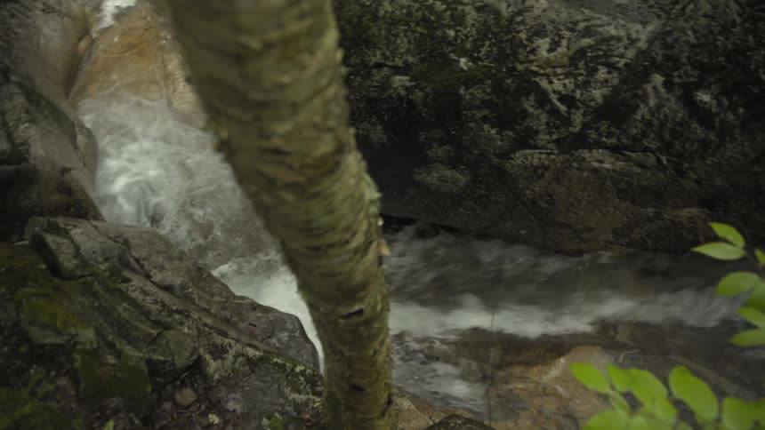 Water rushes through a narrow gorge