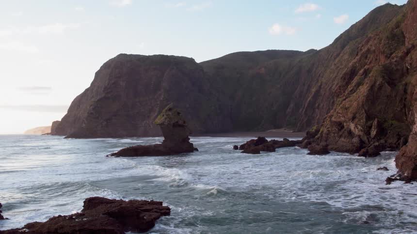 Waves crash onto the rocky shore