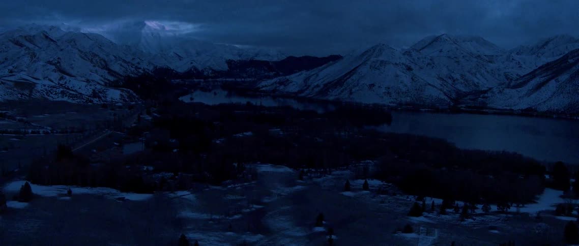 Snow covered mountains at night