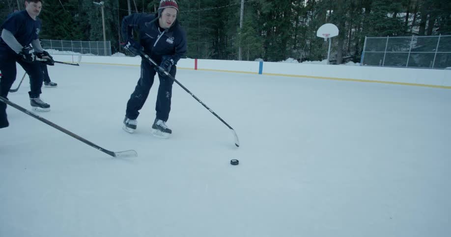 People playing hockey