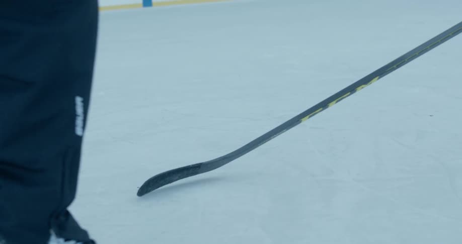 Hockey players are skating and moving the puck