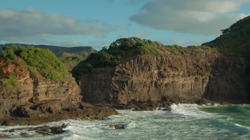 Ocean waves splash and break on the coastal cliffs