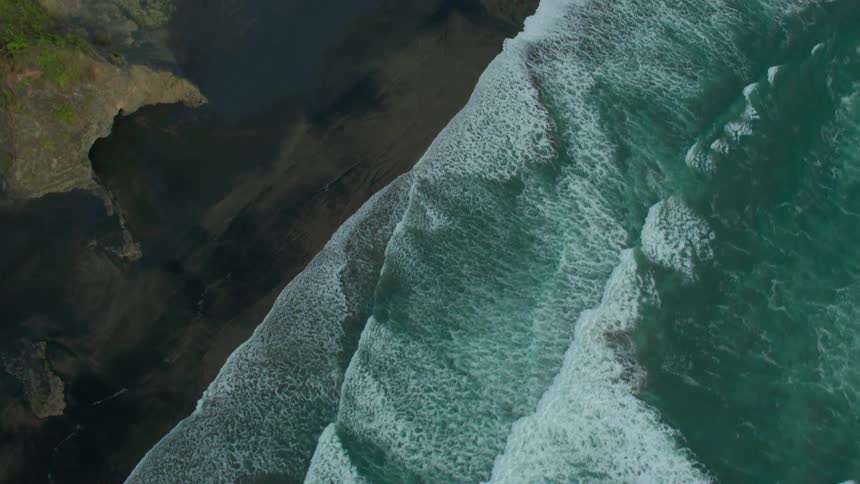 Waves crash onto a beach