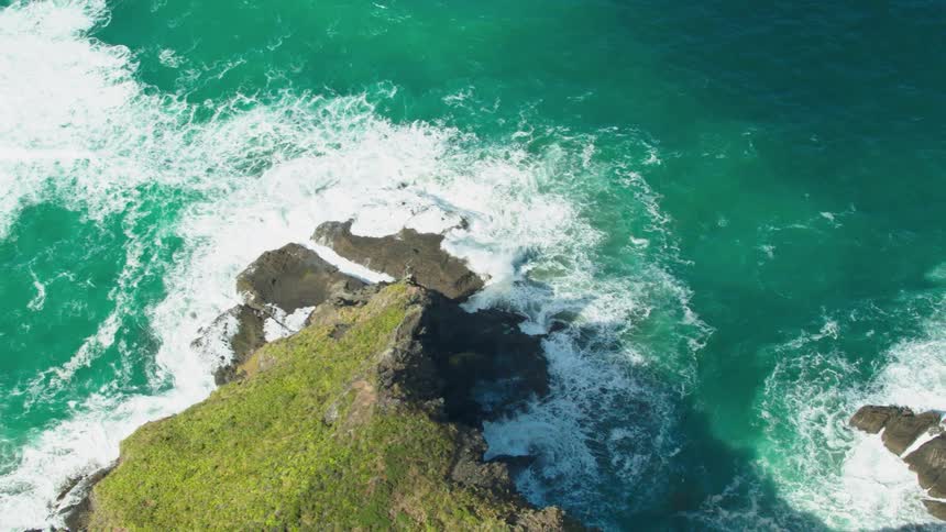 Waves crash onto rocks