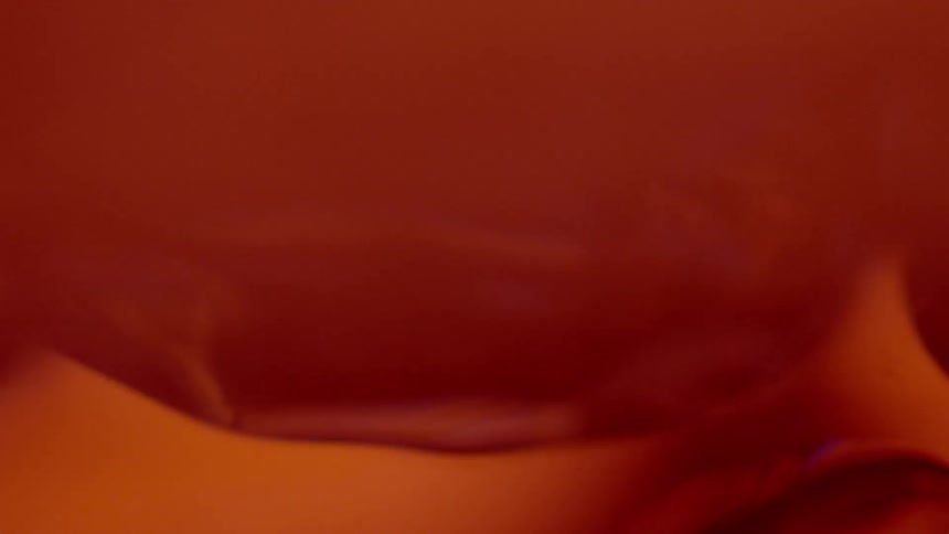 Colors and light blend as liquid drifts in abstract