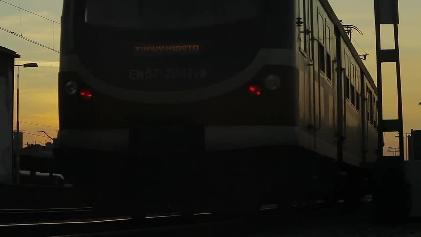 A train passes by at sunset