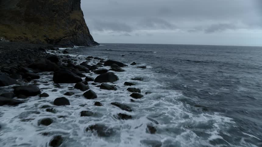 Waves crash onto the rocky shore