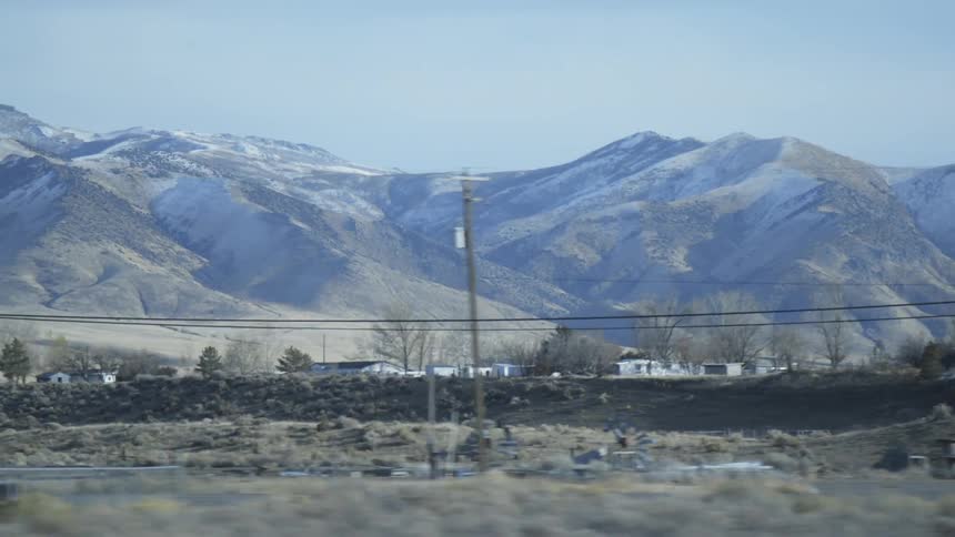 A rural community sprawls in a mountain valley