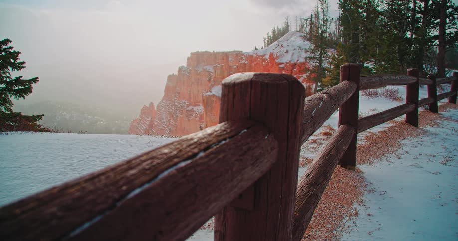 Snow drifts off of the mountain top