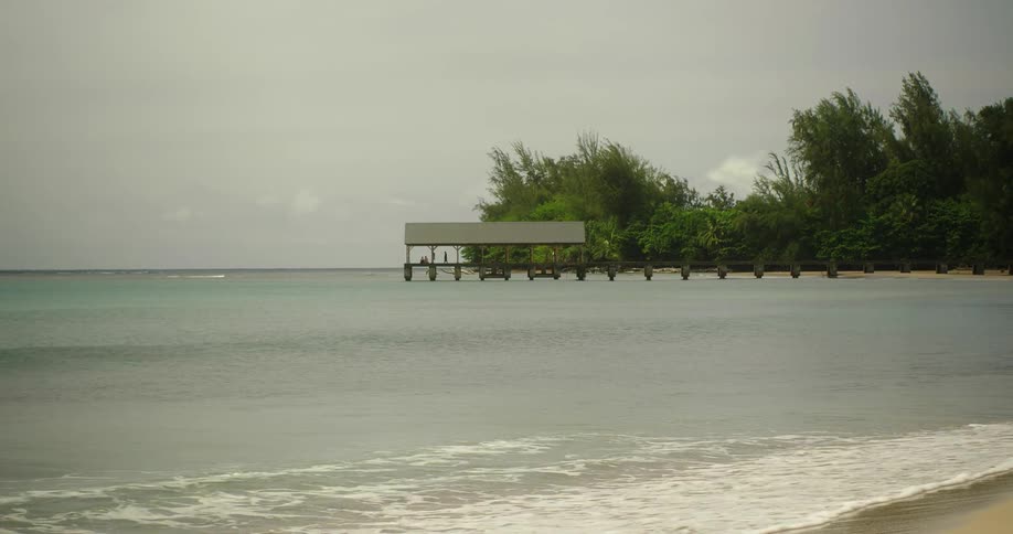 Waves flow onto the beach shore