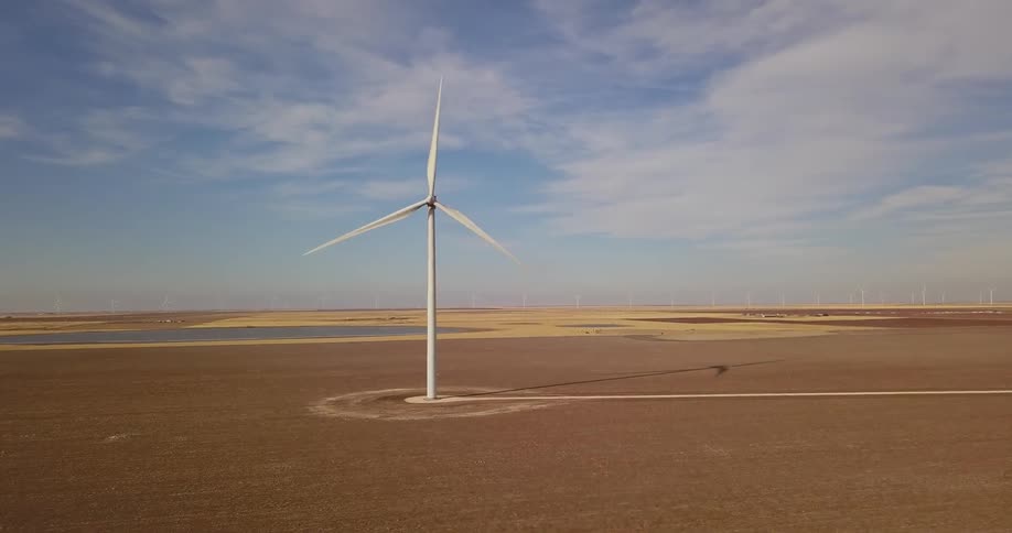 A windmill in a large field