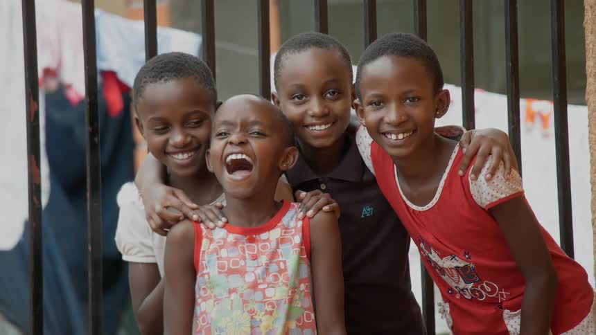 A group of children smiling and posing