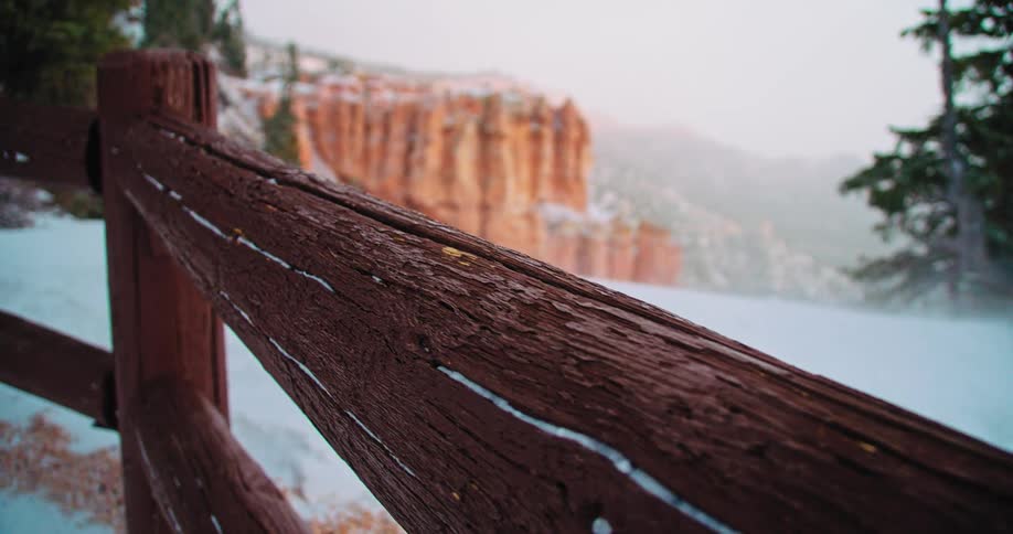 A wooden post blocking a cliff