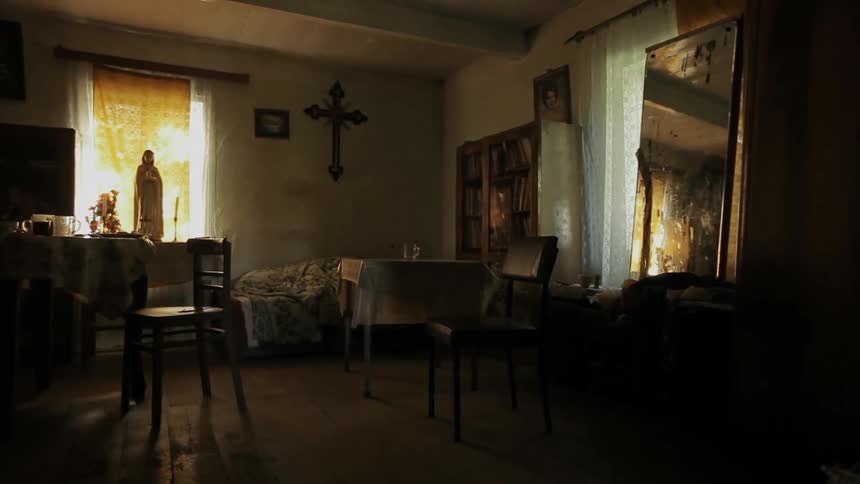 A living room in a house sits undisturbed