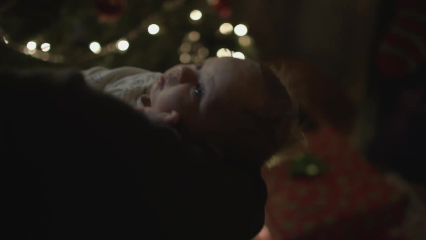 Someone gently bouncing a baby