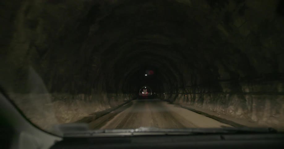 Vehicles travel through an underground tunnel