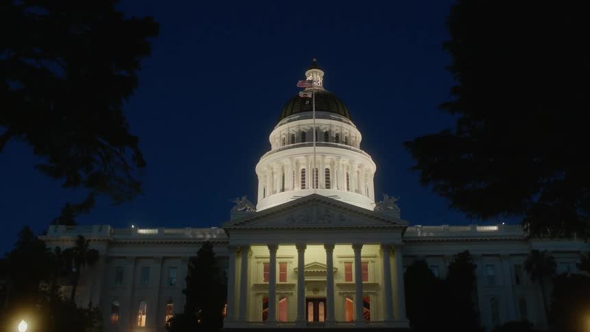 Flags wave above the capitol building