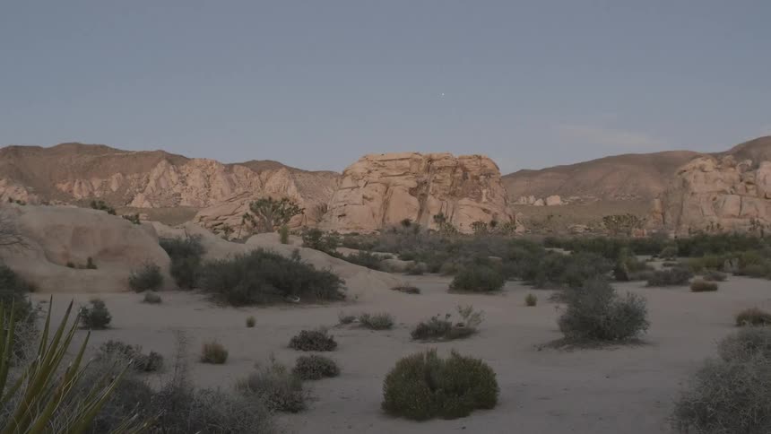 Shadow covers a desert floor during the day