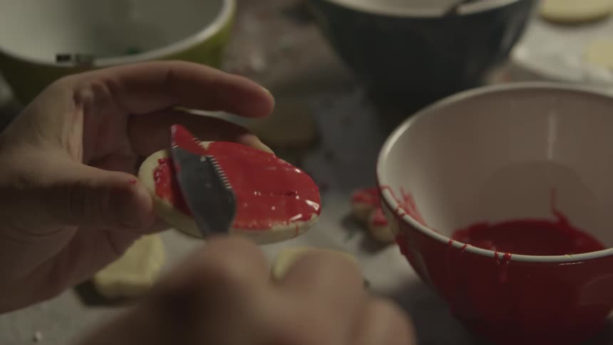 A cookie iced with red icing