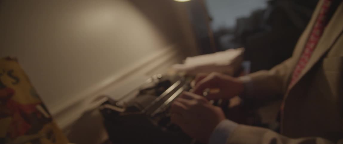 A person using a typewriter