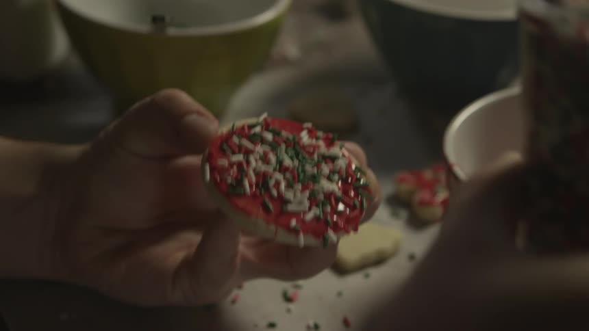 Sprinkles are put on a cookie