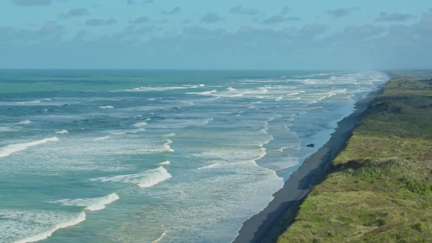 Waves roll toward the shore during the day