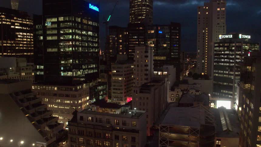 City buildings illuminate the night sky