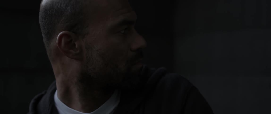 A man stares intently outside