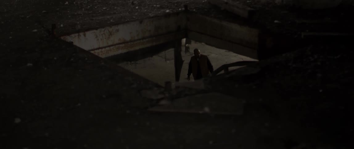 A man is walking in the parking low below