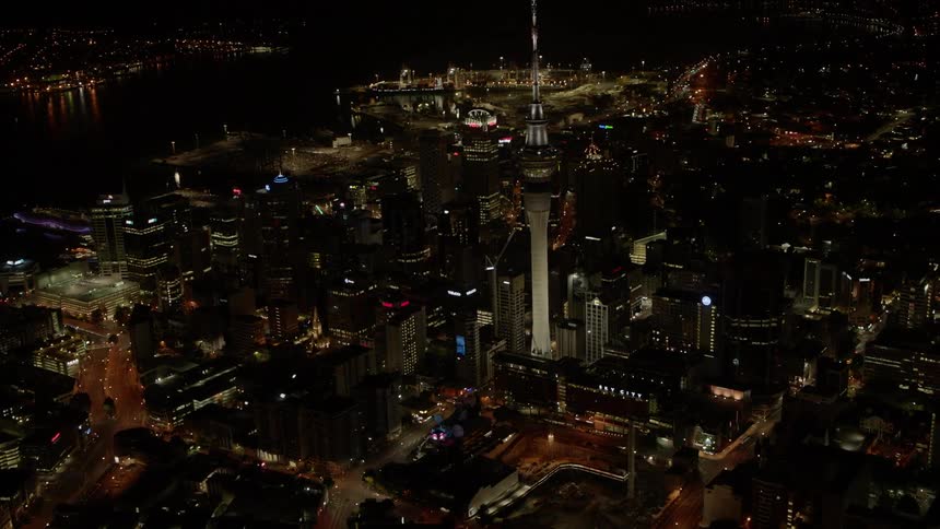 City buildings illuminate the night sky