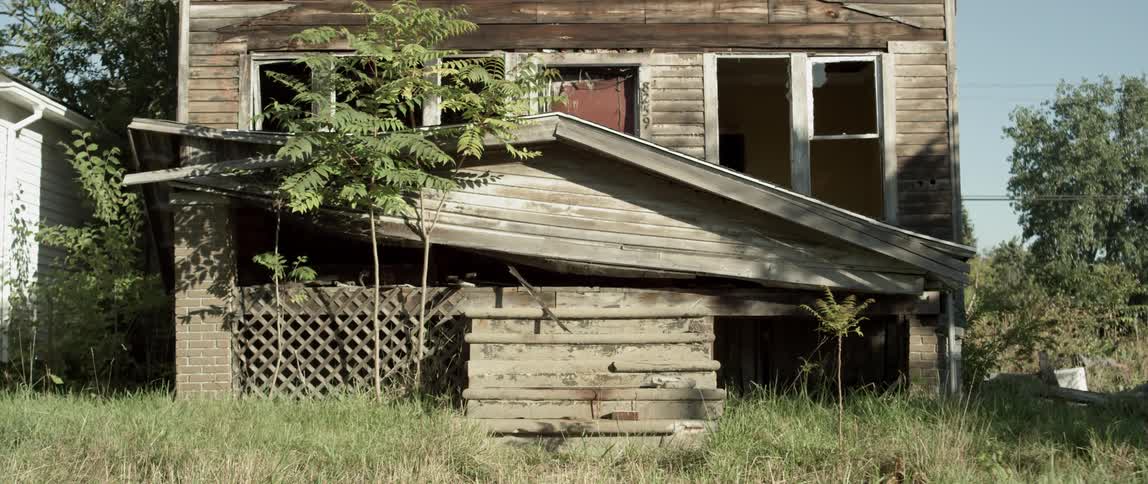 An abandoned house is in ruins
