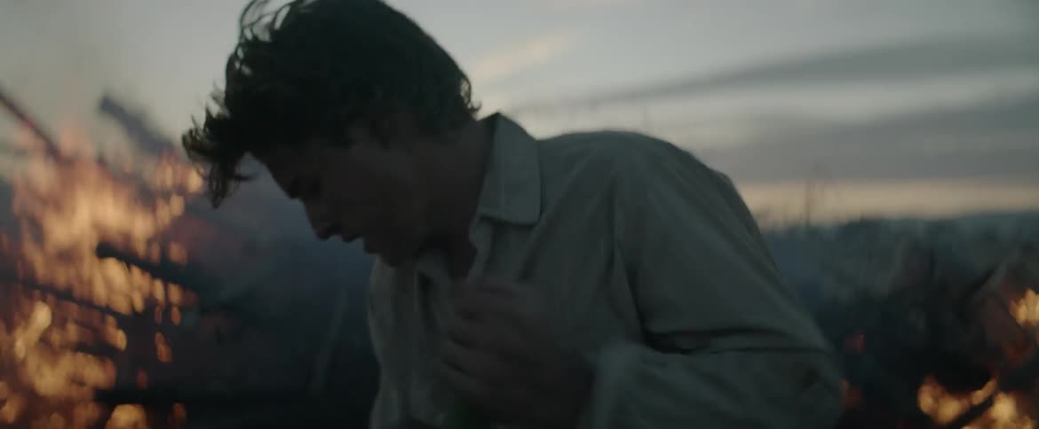 Two men attempt to extinguish a fire