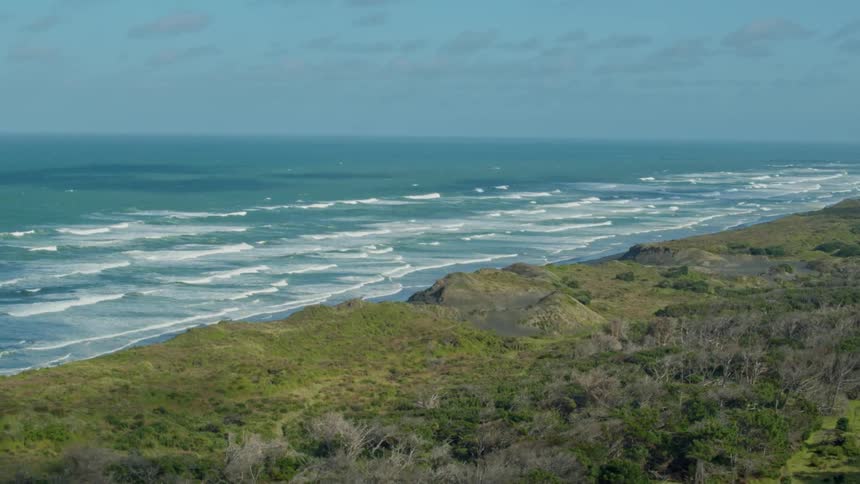 Waves flow onto the beach shore