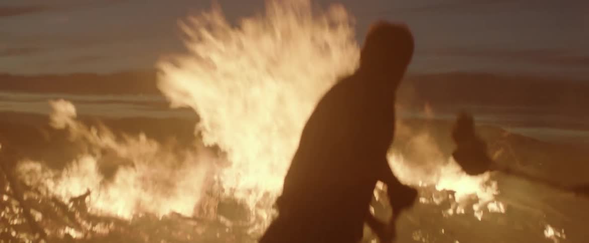 Two men attempt to extinguish a fire