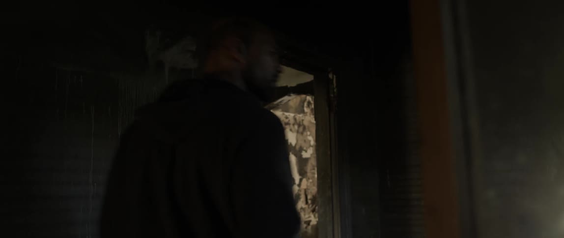 A man walks into a dark house
