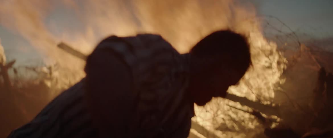 Two men attempt to extinguish a fire