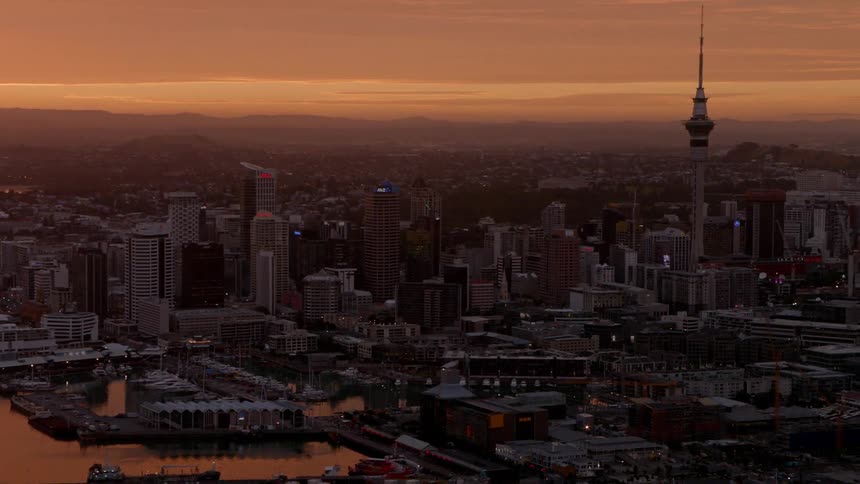A large waterfront city at sunset