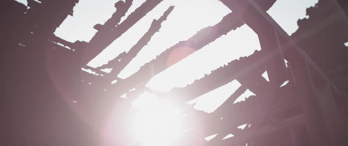 Sunlight filters through an abandoned building